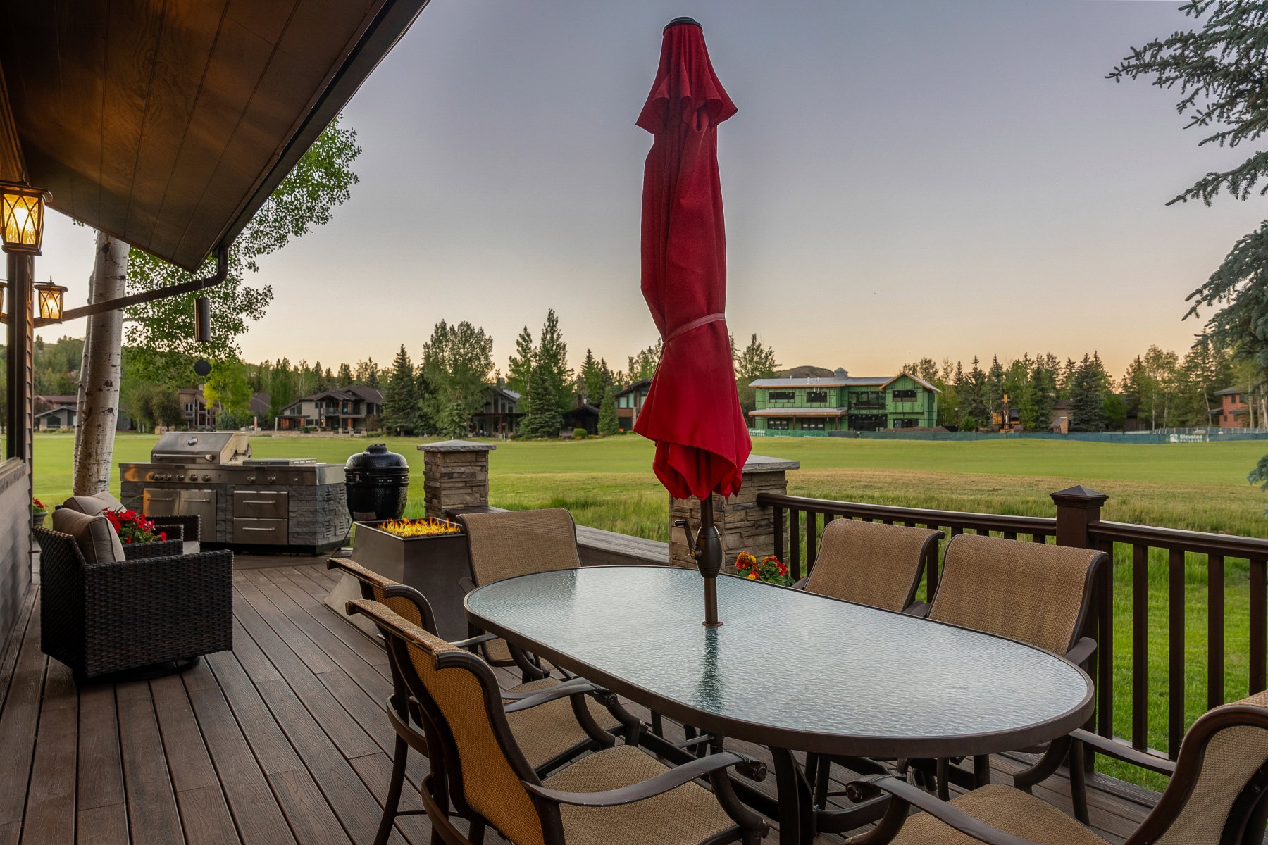 Expansive outdoor deck featuring wood-finish flooring