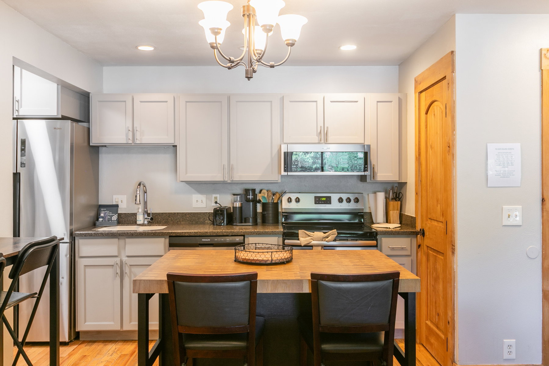 Central kitchen island with wood-finish countertop