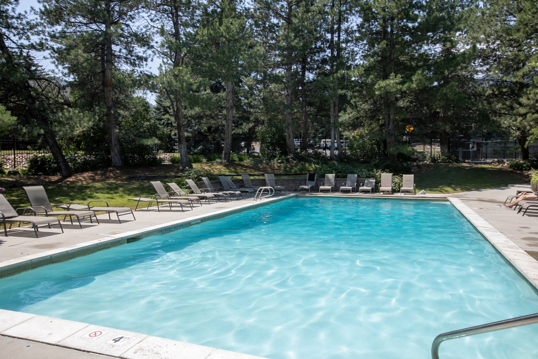 Rectangular swimming pool with a surrounding concrete deck