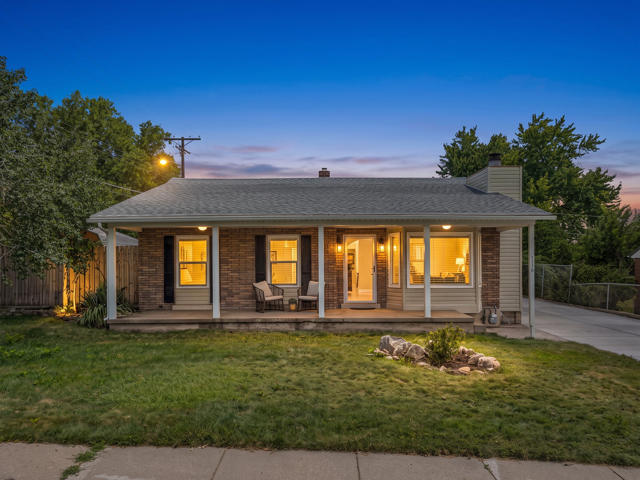Brick and siding exterior with a covered front porch