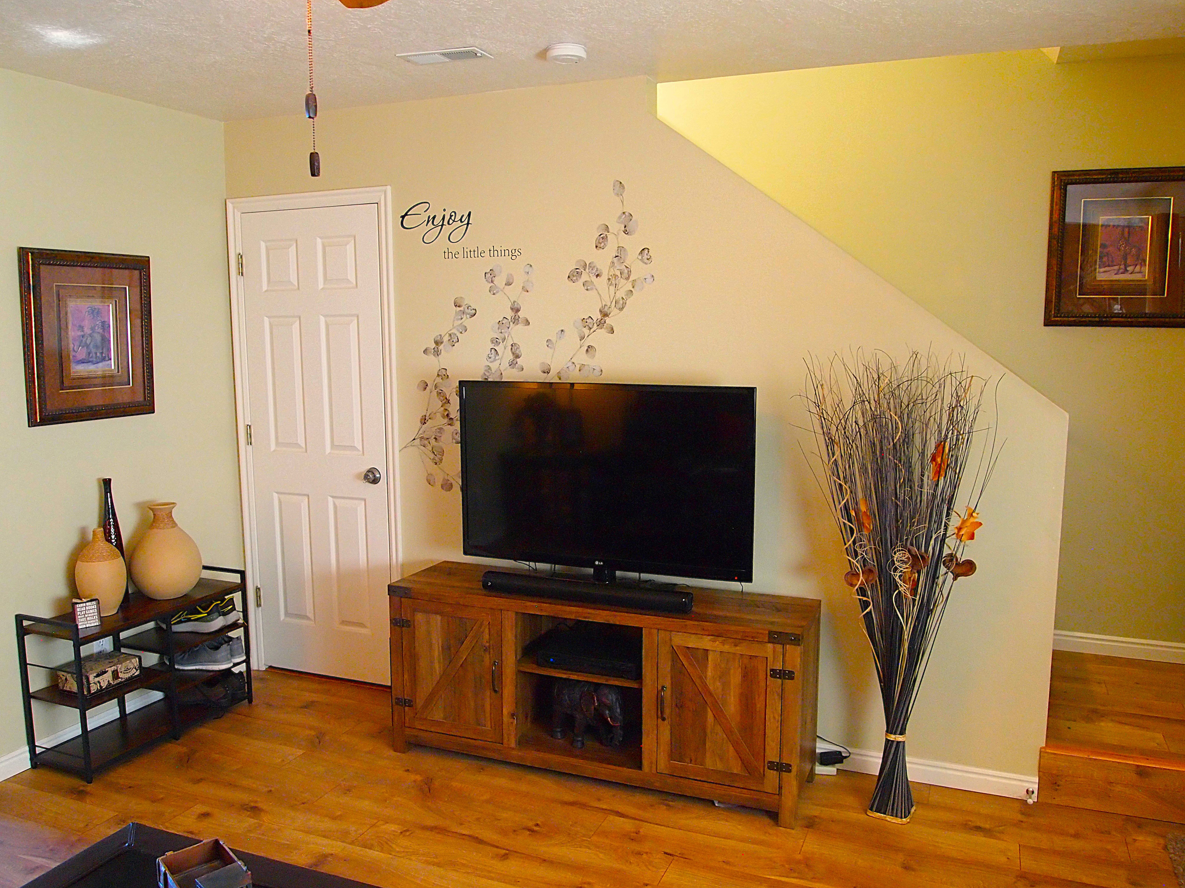 Living area featuring wood-finish flooring and a neutral color palette