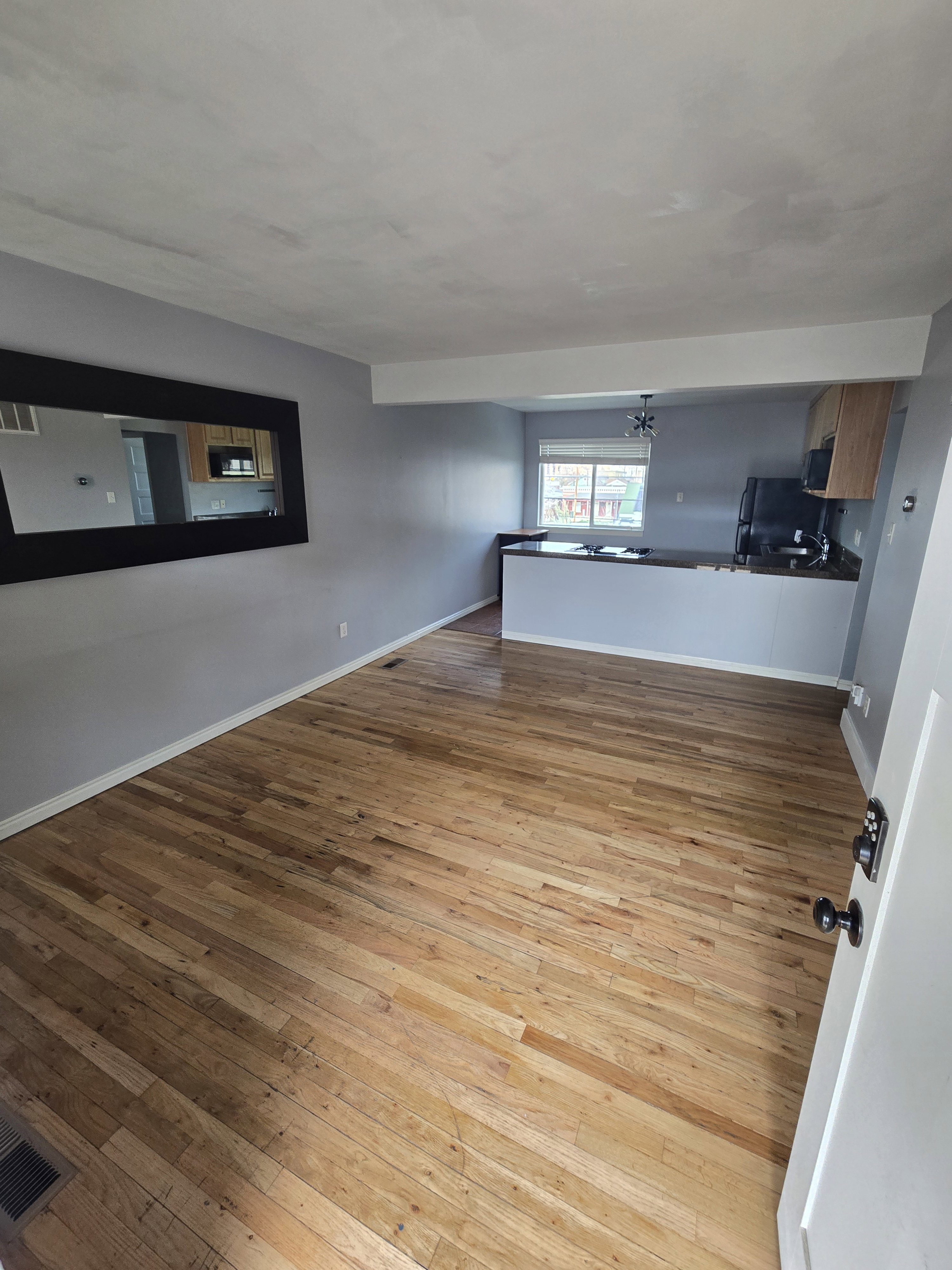 Hardwood flooring throughout the main living area