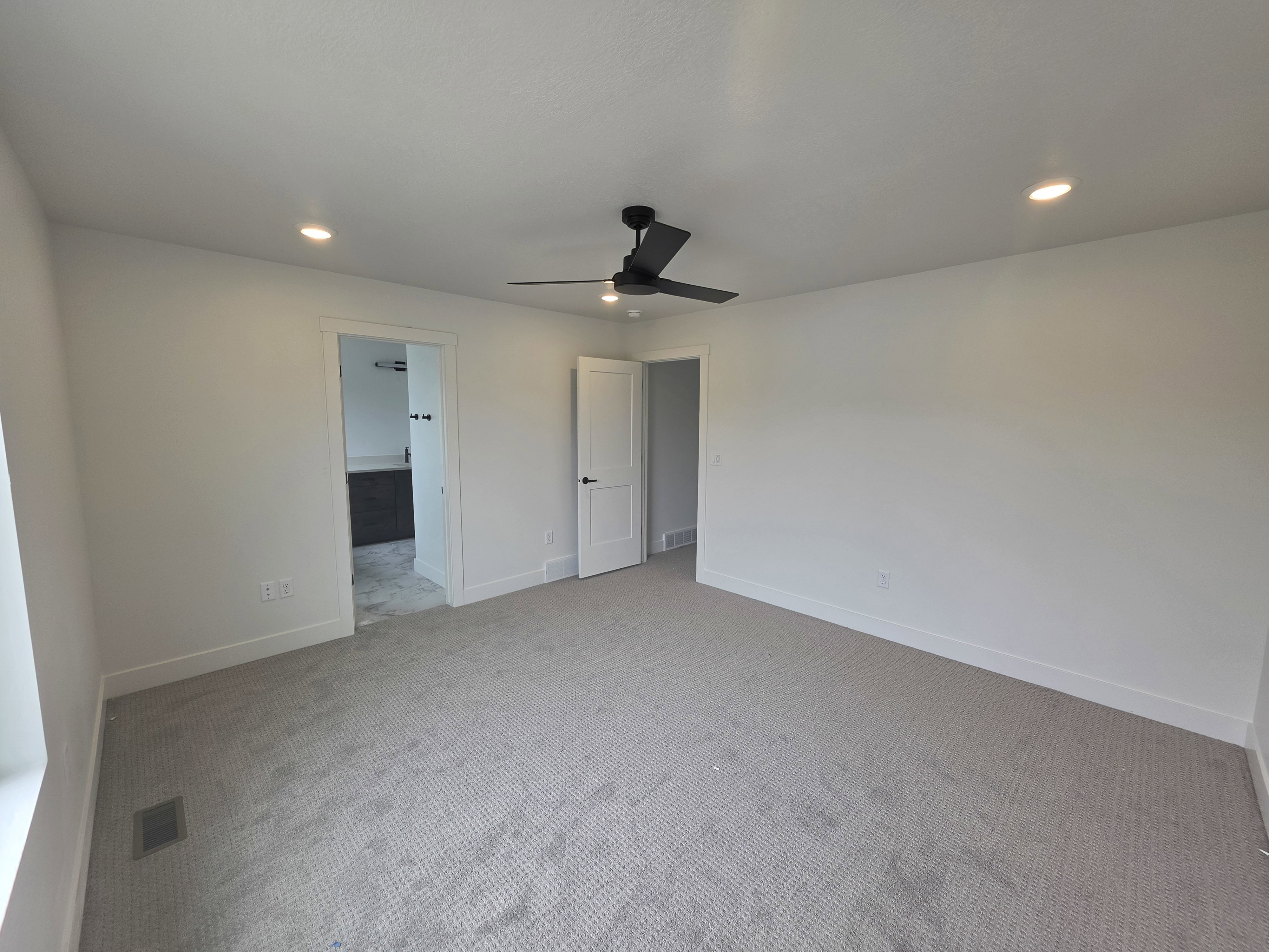 Carpeted room featuring a ceiling fan, recessed lighting, and white baseboards