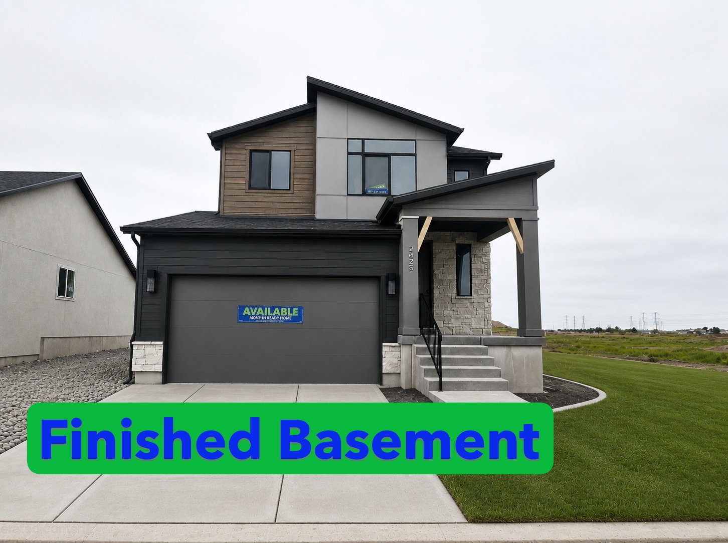 Contemporary exterior featuring multi-textured facade, stone accents, dark gray siding, and wood-finish paneling