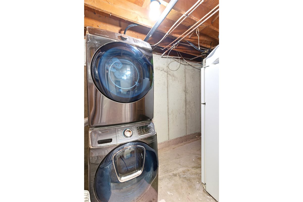 Stackable washer and dryer unit with a visible control panel
