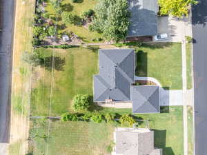 Aerial perspective showcasing the property's expansive grounds, featuring a large, manicured lawn