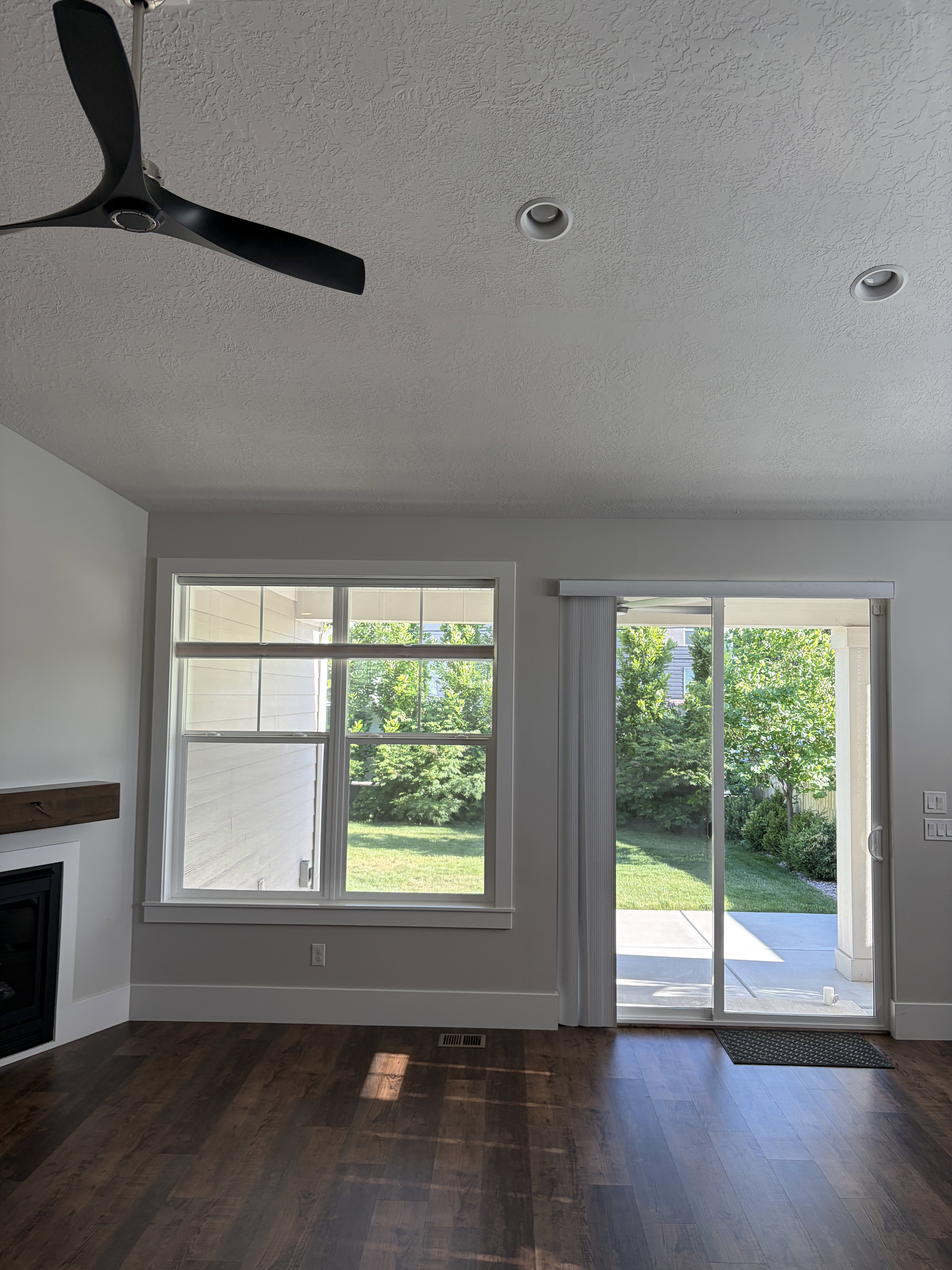 Interior space featuring dark wood-finish flooring, a contemporary ceiling fan, and recessed lighting