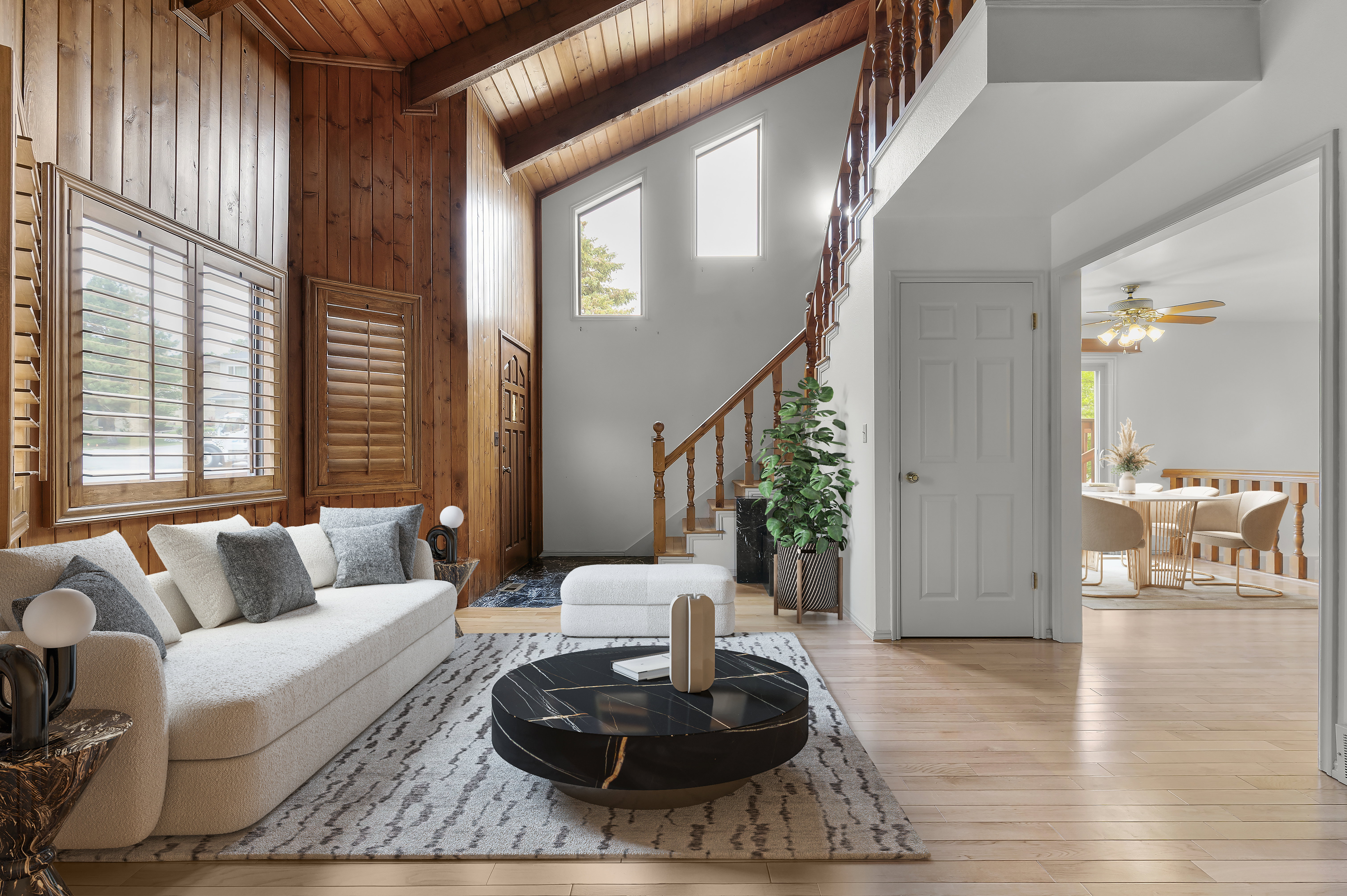Entryway and living room with vaulted ceilings- virtually staged