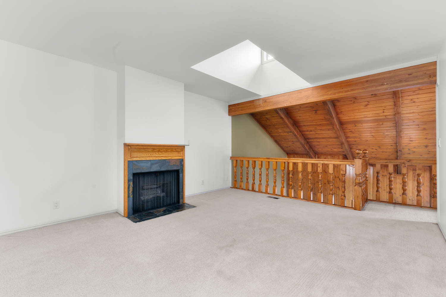 Upper level den with fireplace- unstaged