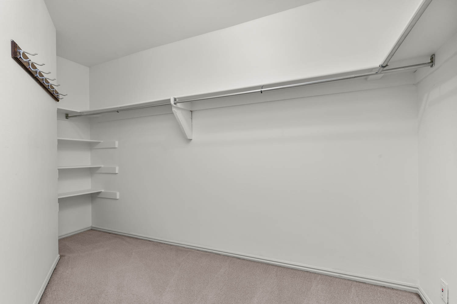 Primary bedroom walk-in closet