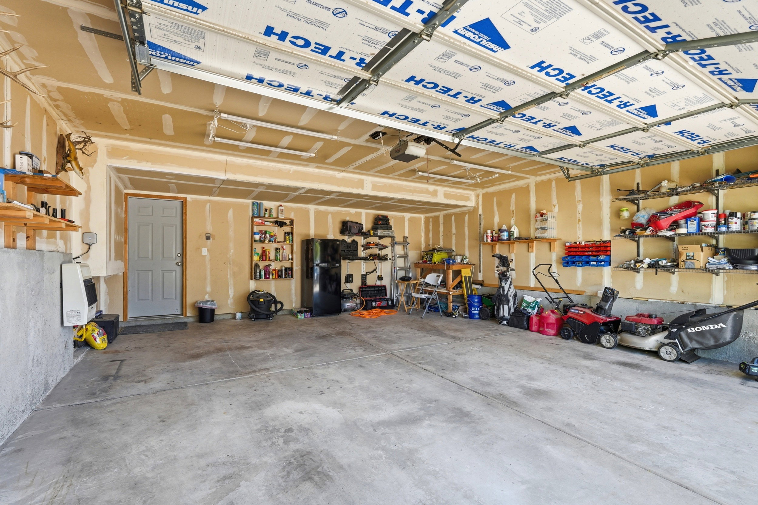 Spacious garage with concrete flooring