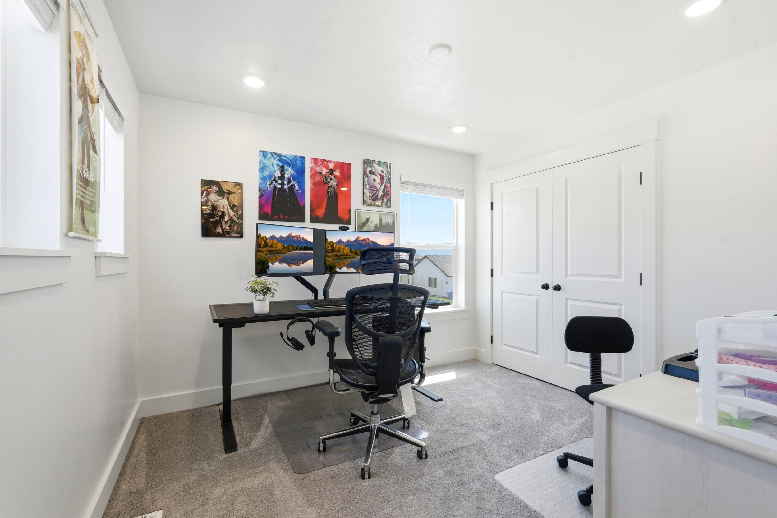 Room with light gray carpet flooring, white walls, and recessed lighting