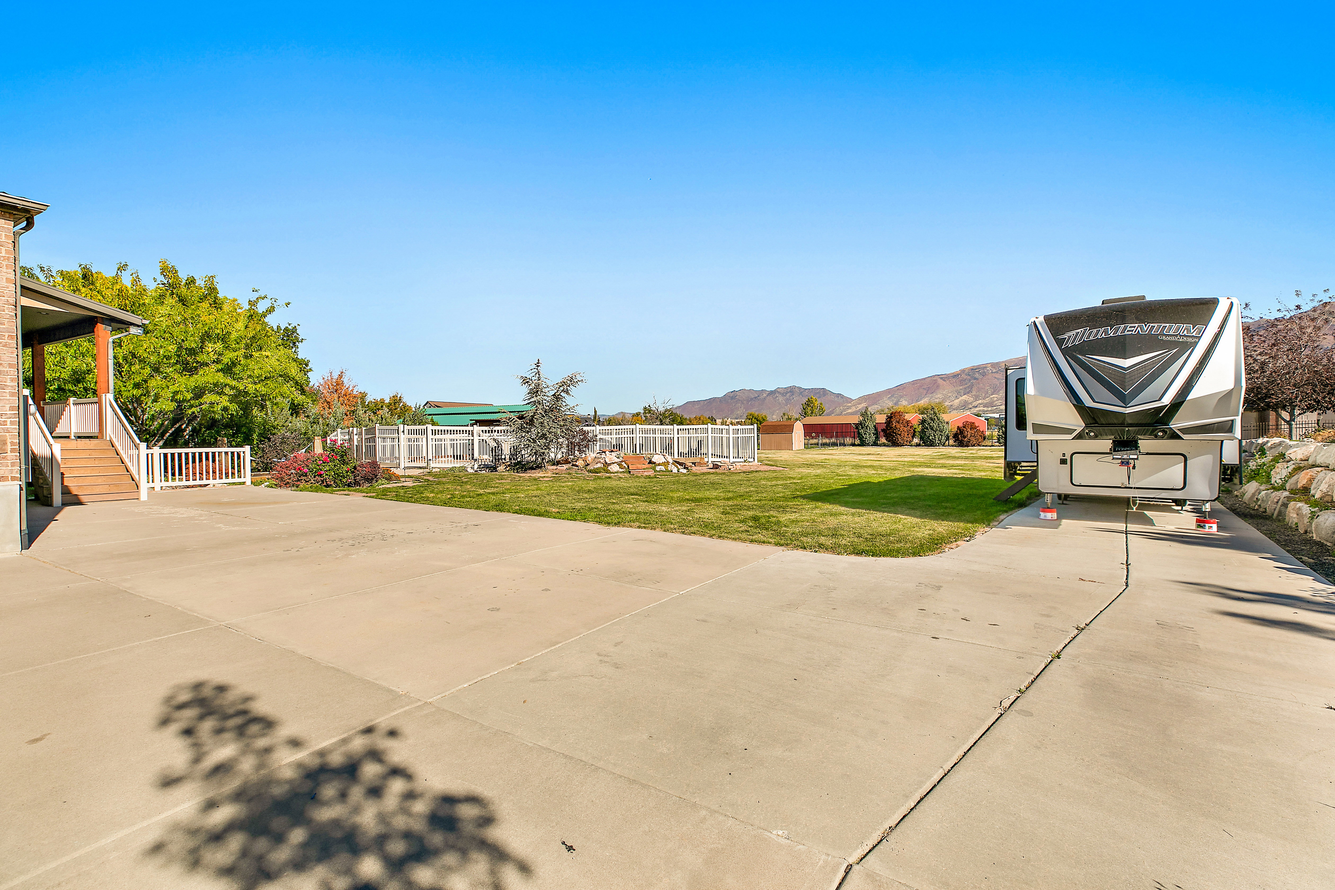 Expansive concrete driveway with dedicated RV parking
