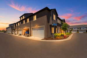 Modern townhome exterior featuring a combination of stucco and horizontal siding