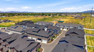 Aerial perspective of a multi-unit residential community featuring townhome-style properties