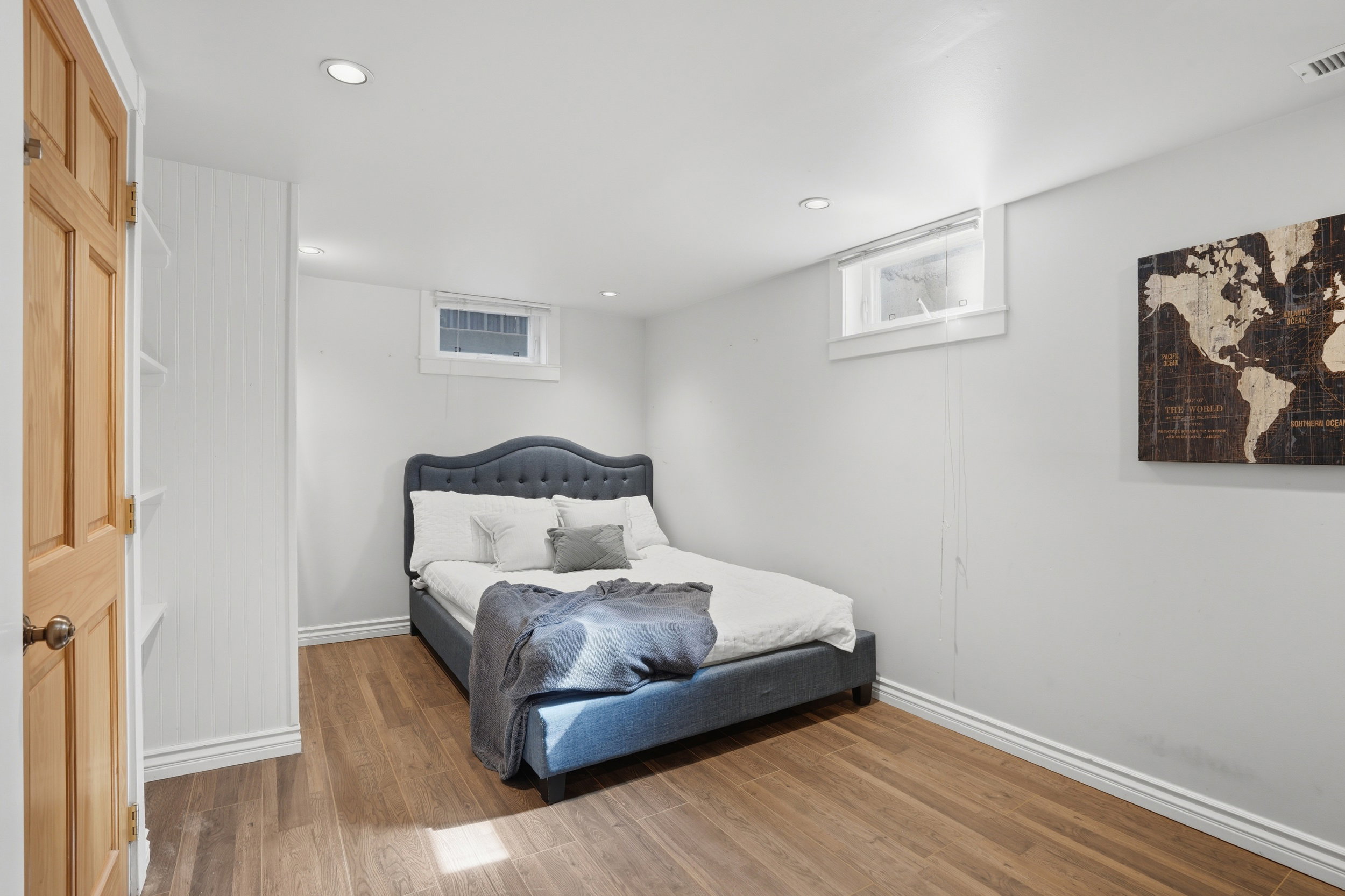 Bright interior space featuring wood-finish flooring, recessed lighting, and a neutral wall palette