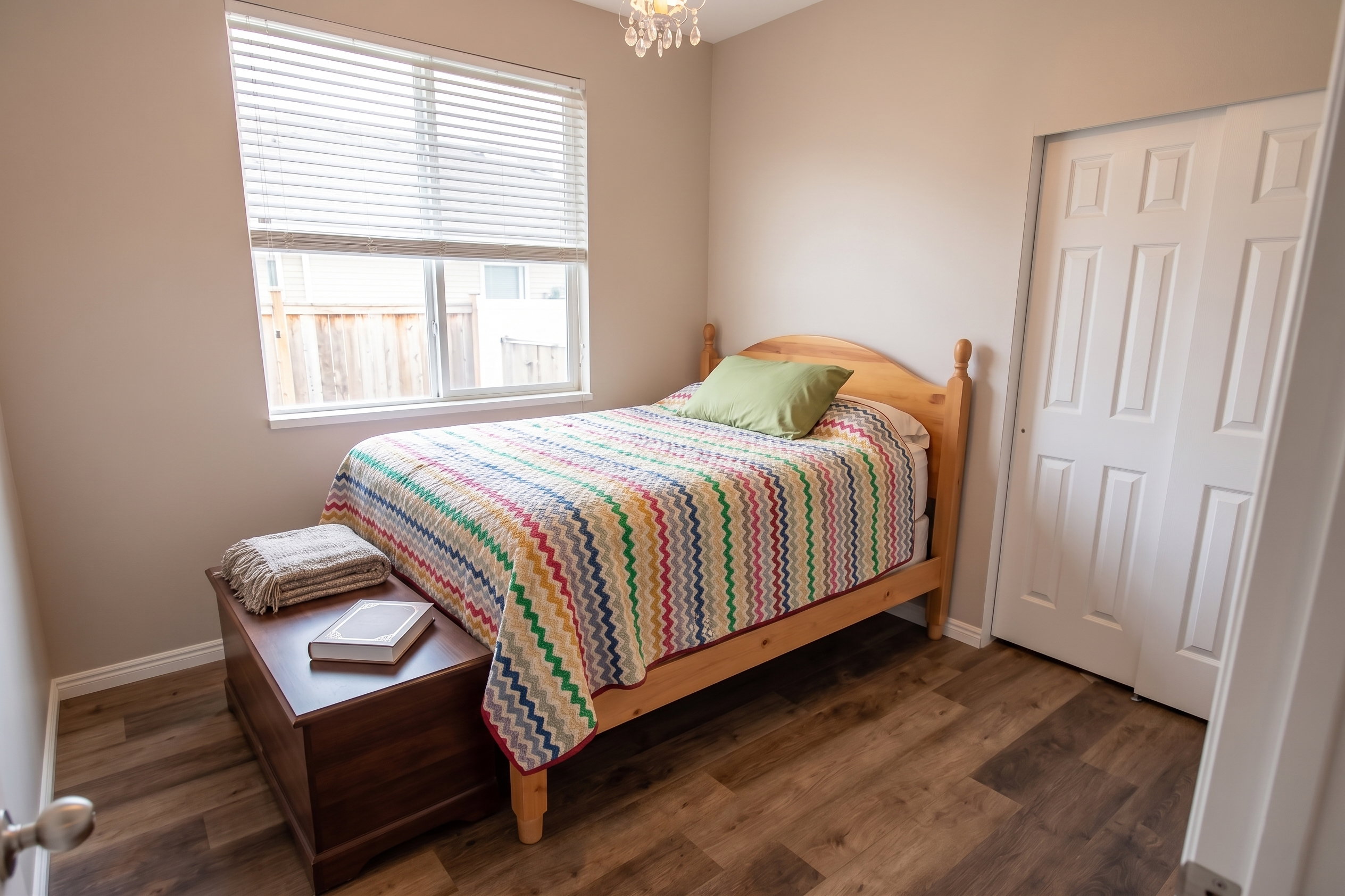 Bedroom with LVP flooring and a closet
