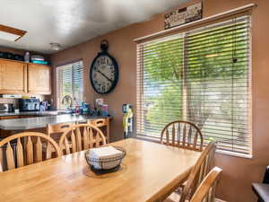 Bright kitchen with wood-finish cabinetry and a large window
