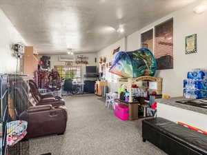 Spacious room featuring carpeting, recessed lighting, and multiple windows with blinds