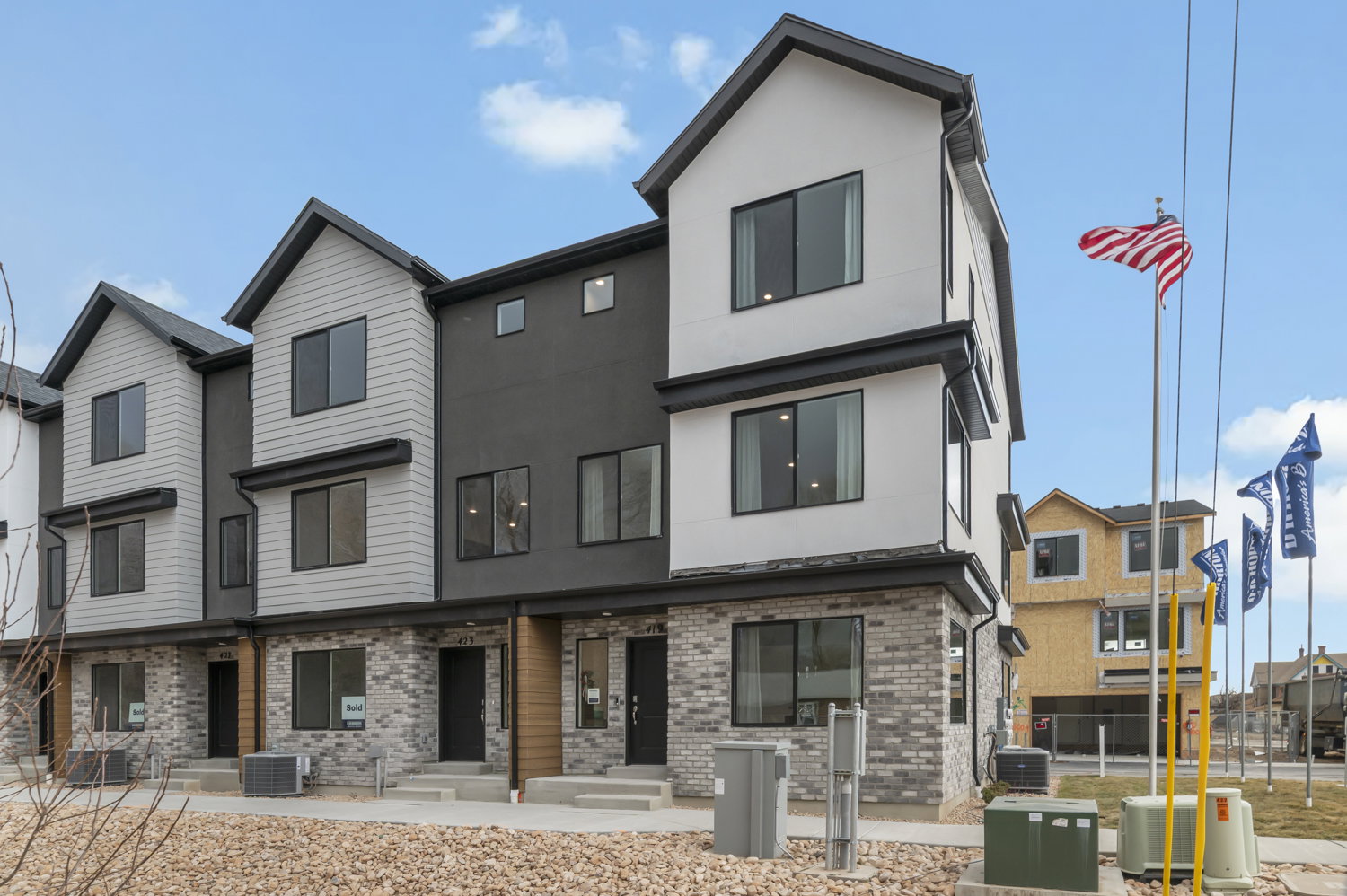 Modern townhome exteriors featuring multi-level design