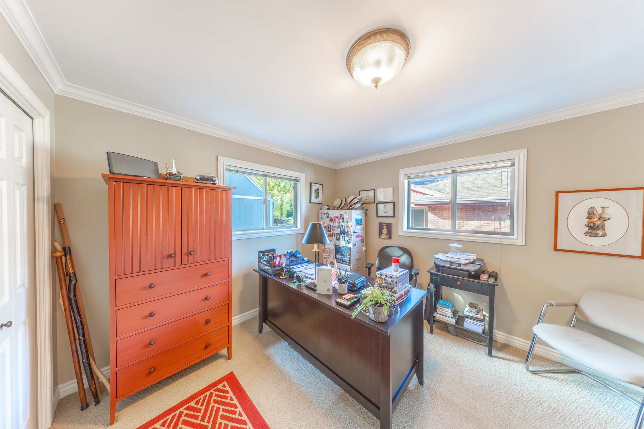 Neutral-toned walls complement the light-colored carpeting