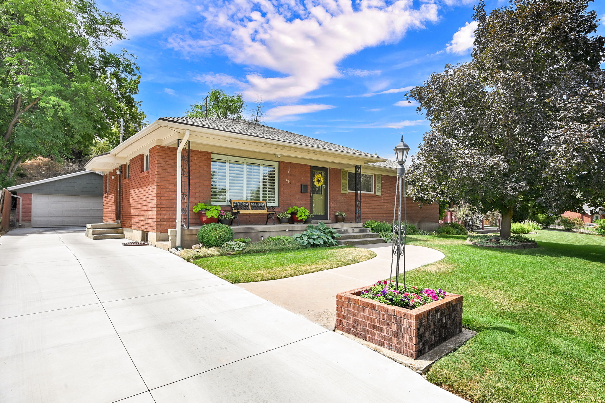 Brick house with detached garage fully landscaped yard