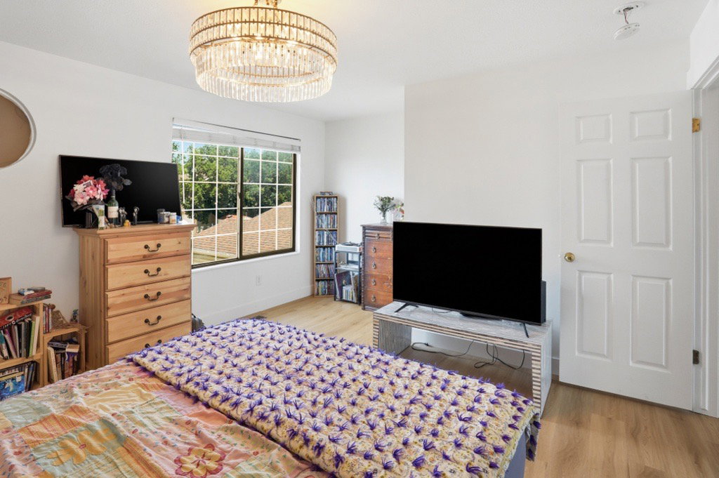 Bright white walls complement wood-finish flooring