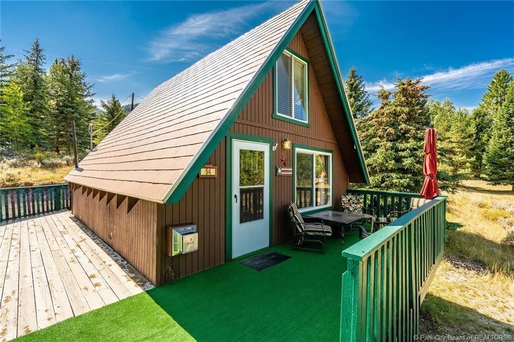 A-frame exterior with brown siding and green trim