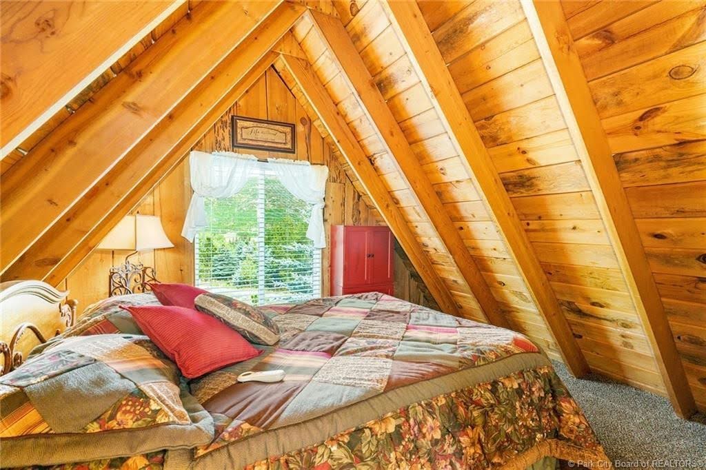 Vaulted wood-paneled ceiling with exposed beams