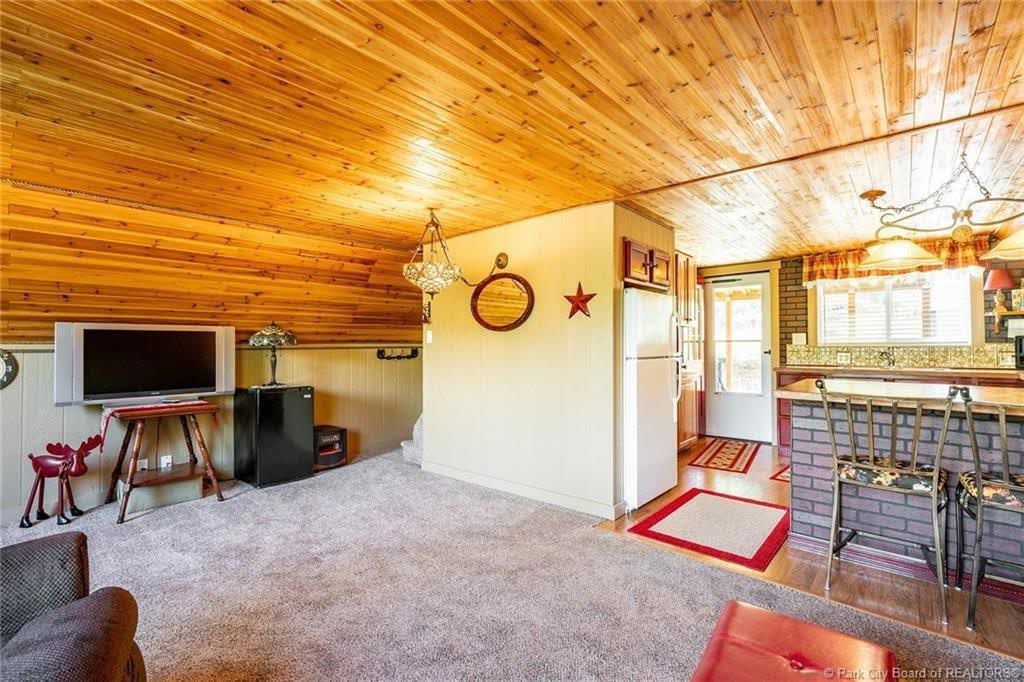 Wood-paneled ceiling with recessed lighting