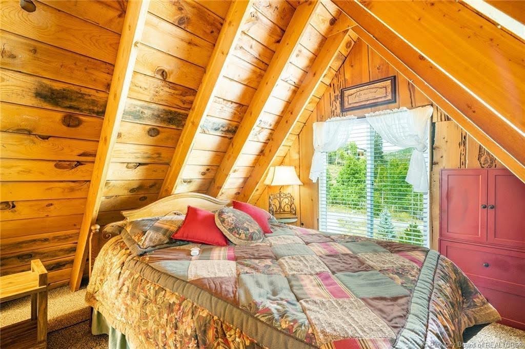 Vaulted wood-paneled ceiling with exposed beams