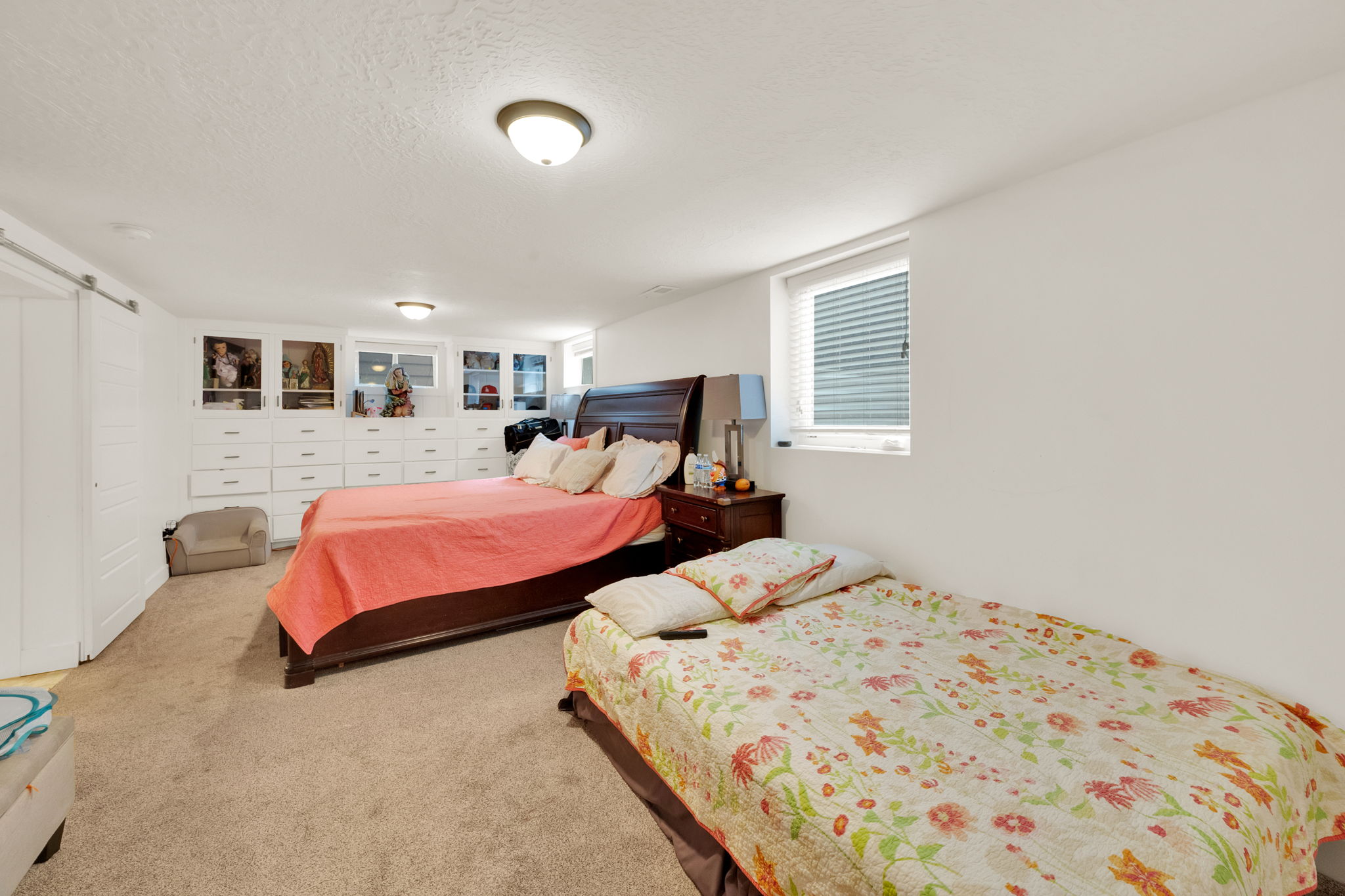 Spacious interior featuring neutral carpet flooring and white walls