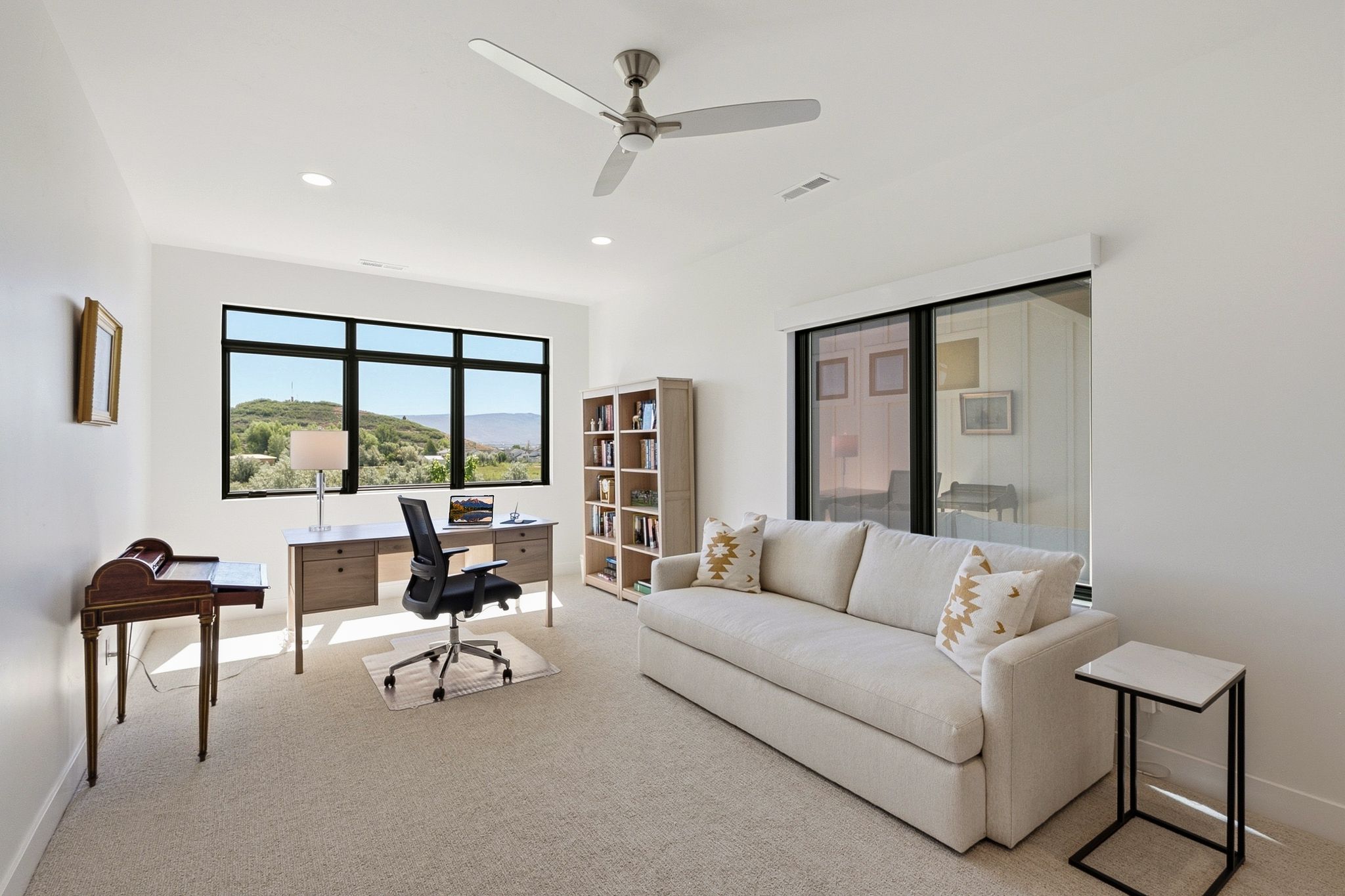 Room featuring light-colored carpeting and white walls