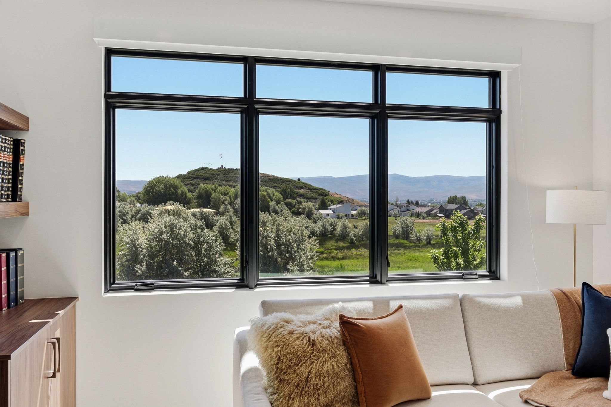 Large picture window with black framing and white trim