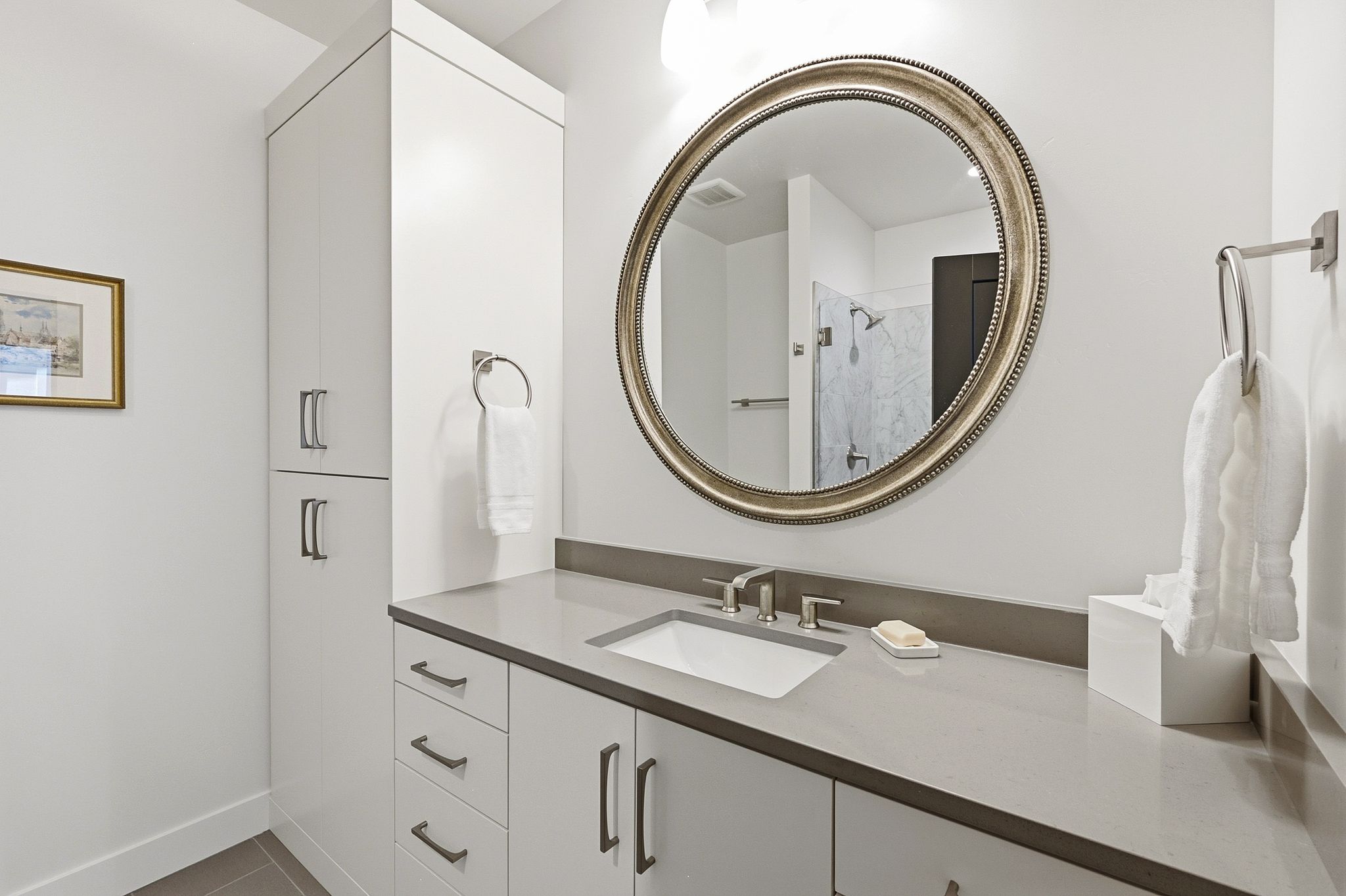 Modern vanity with a rectangular undermount sink and a light gray countertop