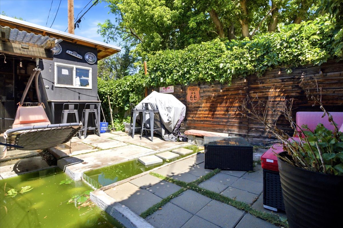Outdoor patio with concrete pavers and integrated water feature