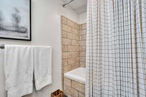 Bathtub with textured tile surround