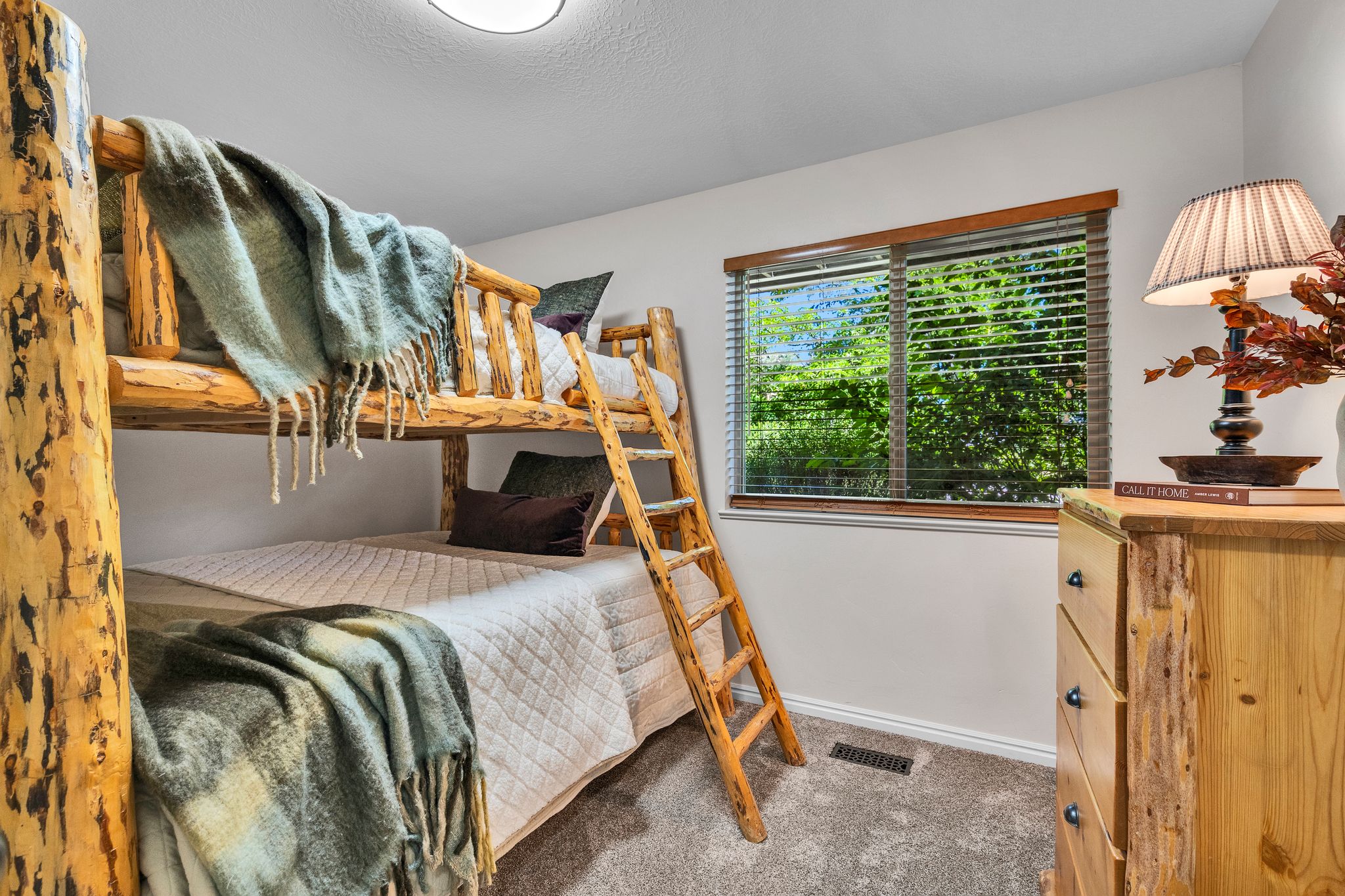 Rustic wood bunk beds with integrated ladder