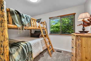 Rustic wood bunk beds with integrated ladder