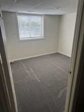 Room featuring neutral-toned walls and grey carpeting