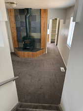Wood stove with a slate tile surround and wood panel accents