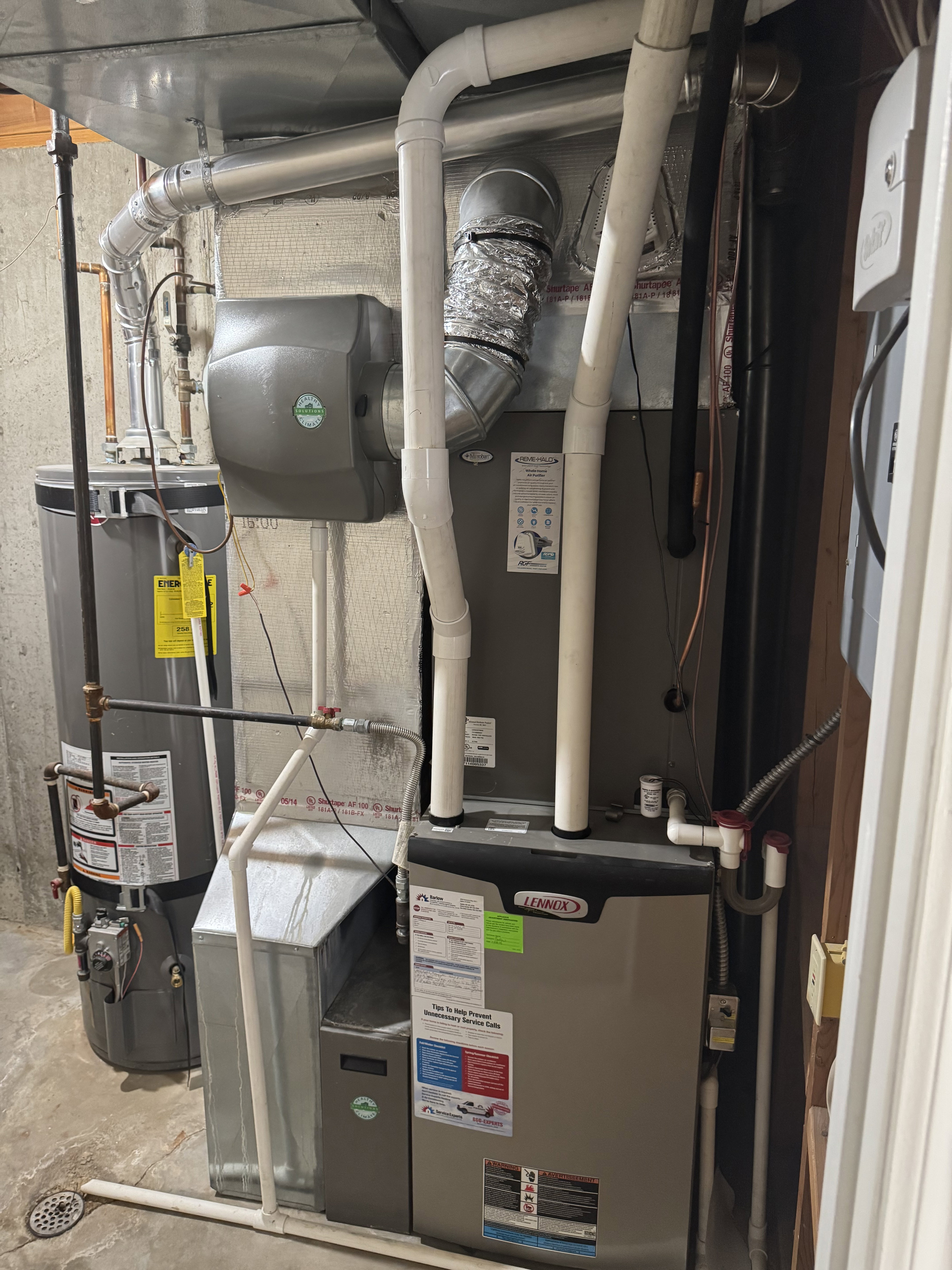 Comprehensive HVAC system featuring a Lennox furnace, water heater, and an attached humidifier