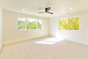 Bright interior space with light-toned carpeting and white walls