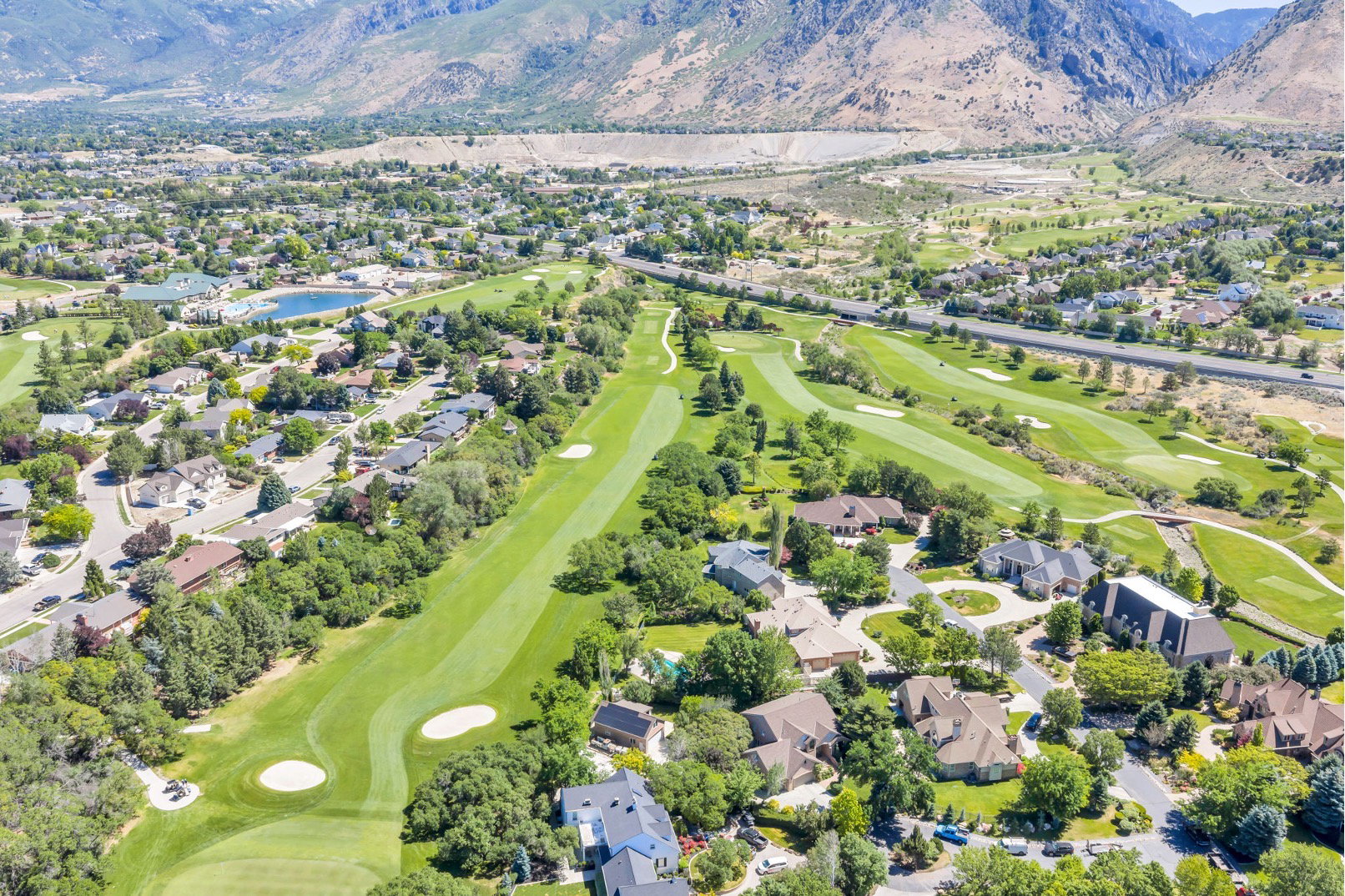 Expansive golf course community with mountain backdrop
