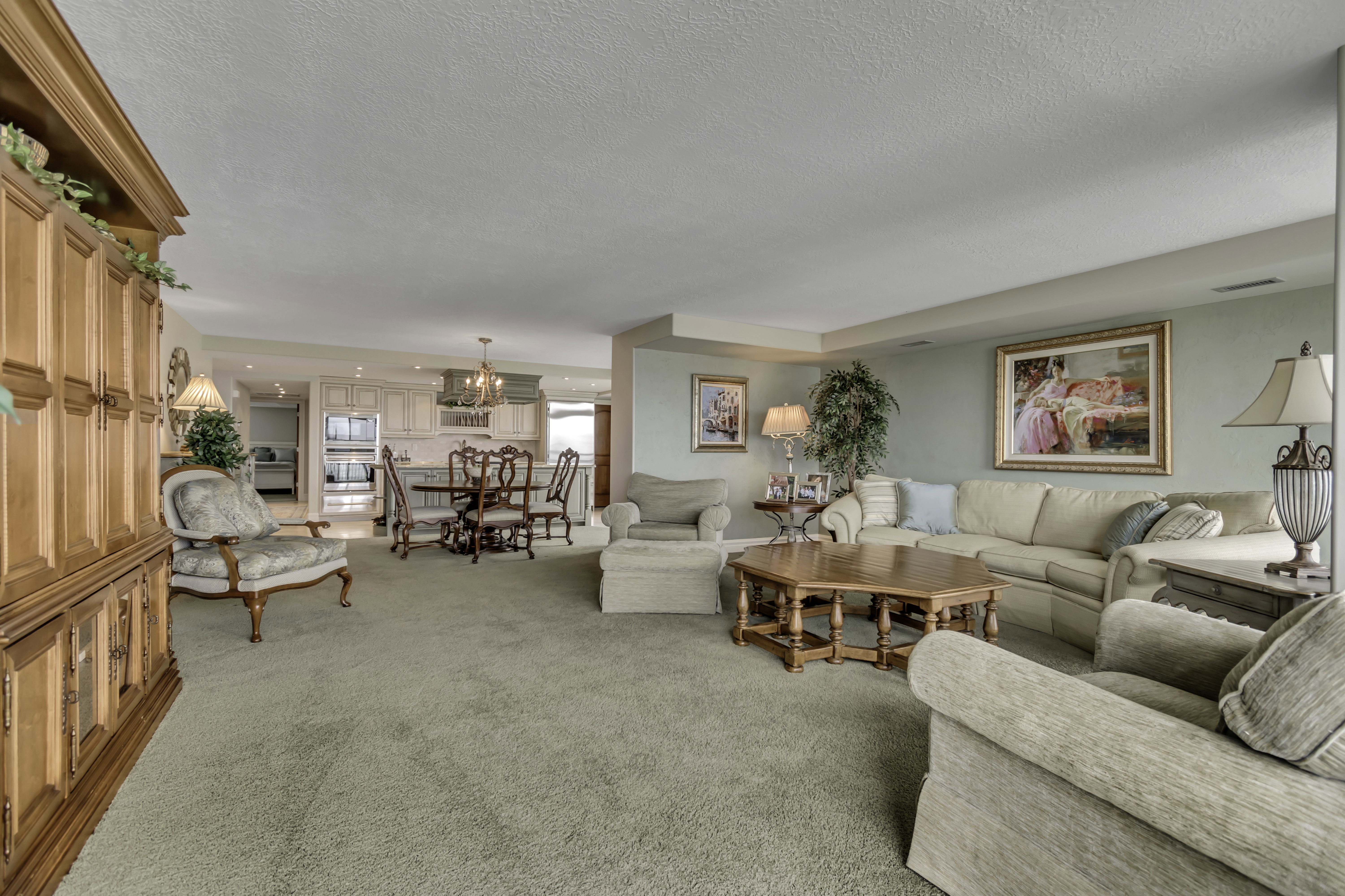 Expansive living area featuring carpet flooring, and light-toned wall paint