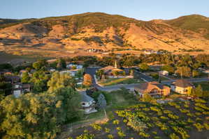 Expansive mountain backdrop framing a residential area with varied home styles