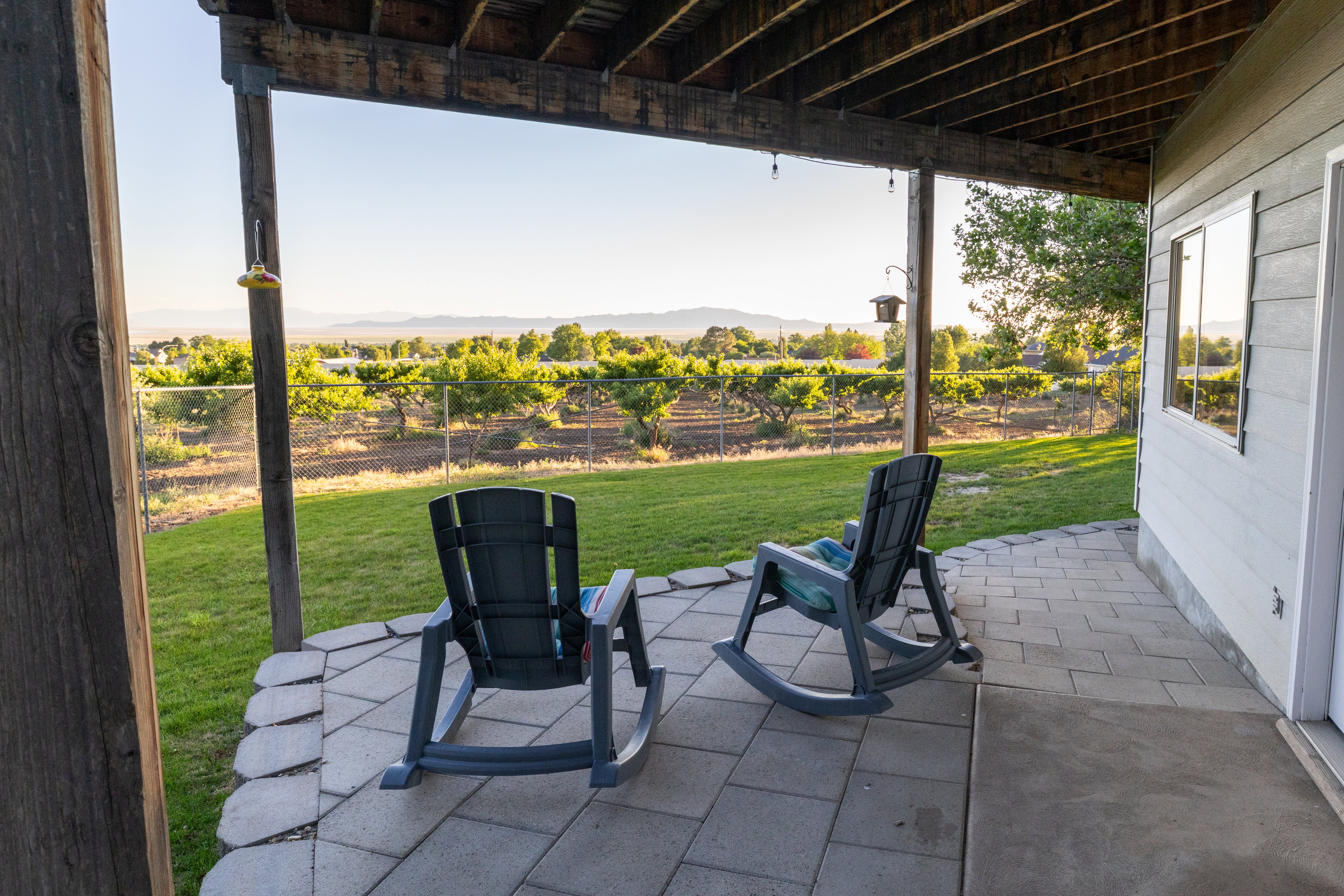 Covered patio with paver and concrete flooring