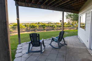 Covered patio with paver and concrete flooring