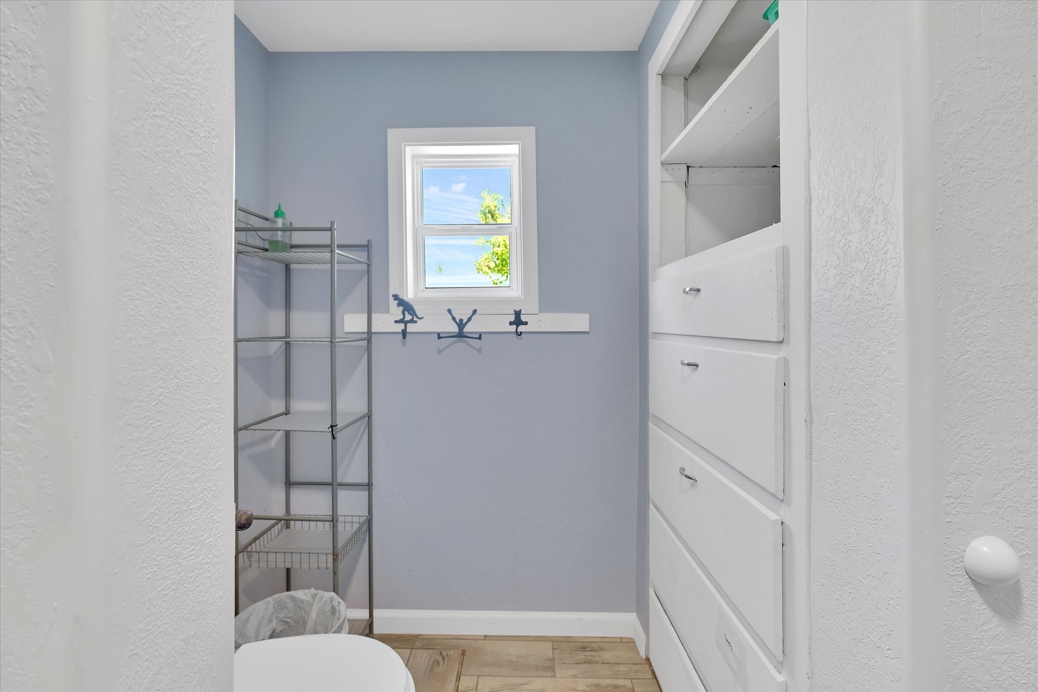 Built-in shelving and drawers provide storage solutions