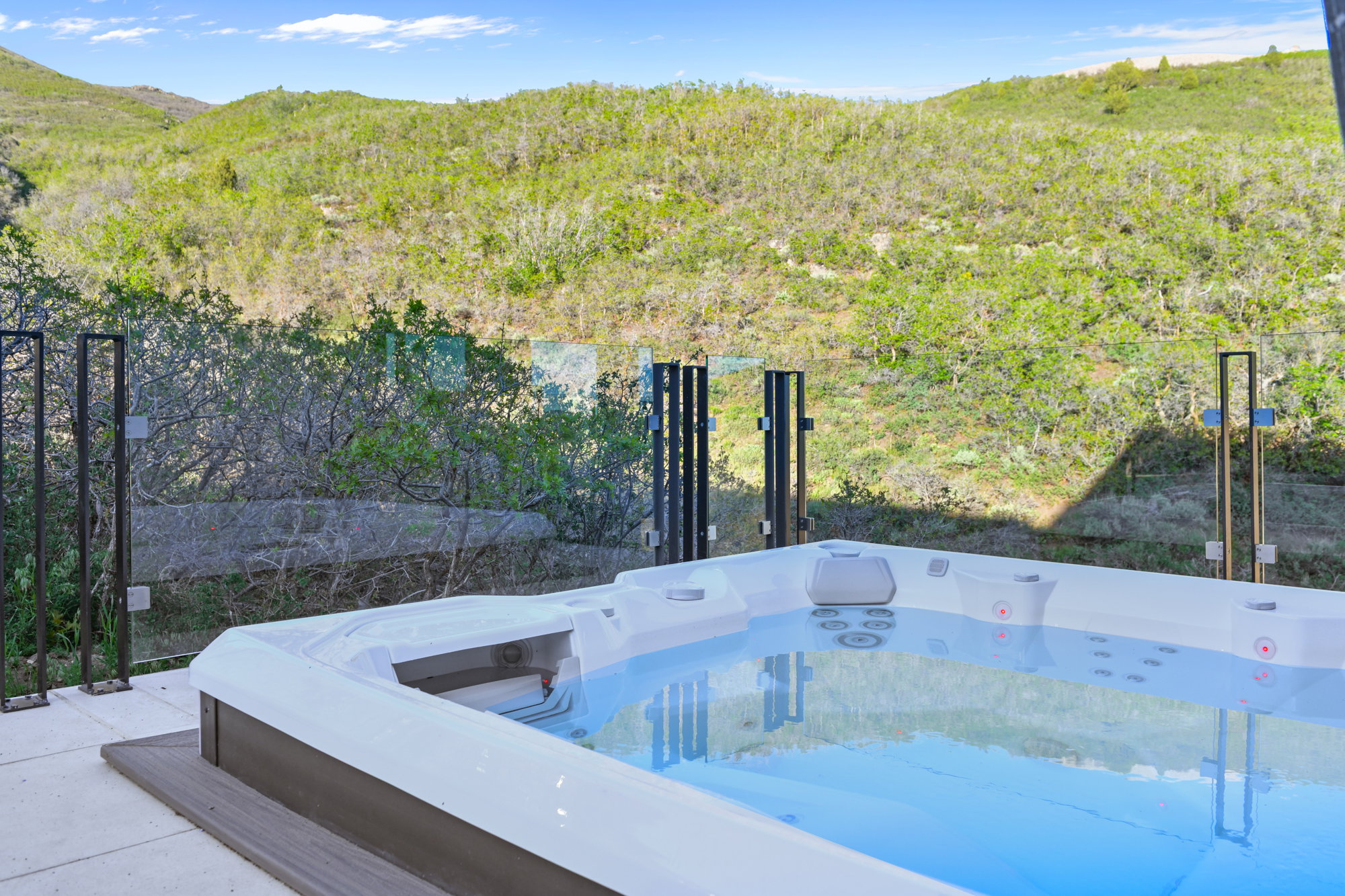 Outdoor spa with a clear water surface